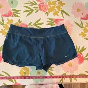 Ladies Nike, athletic shorts, size 12 with built-in liner, blue, and teal